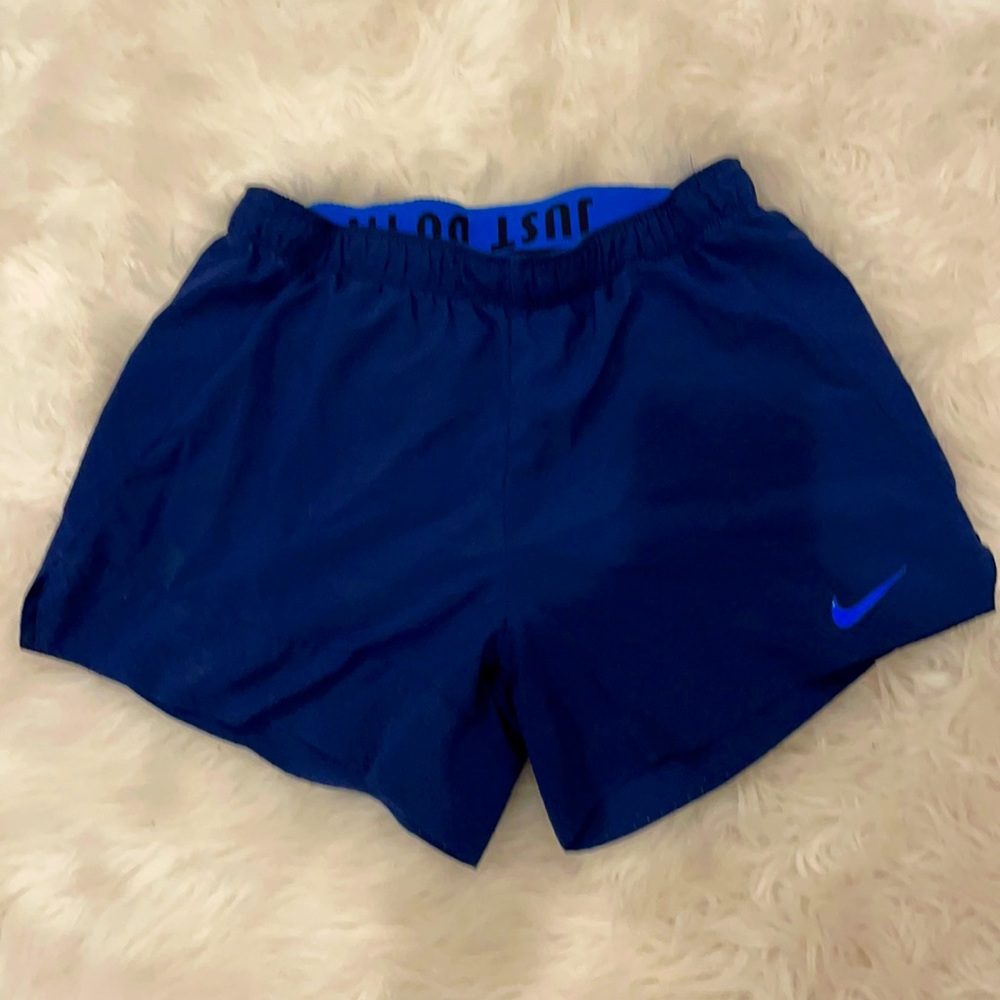 Nike women’s blue athletic shorts, medium